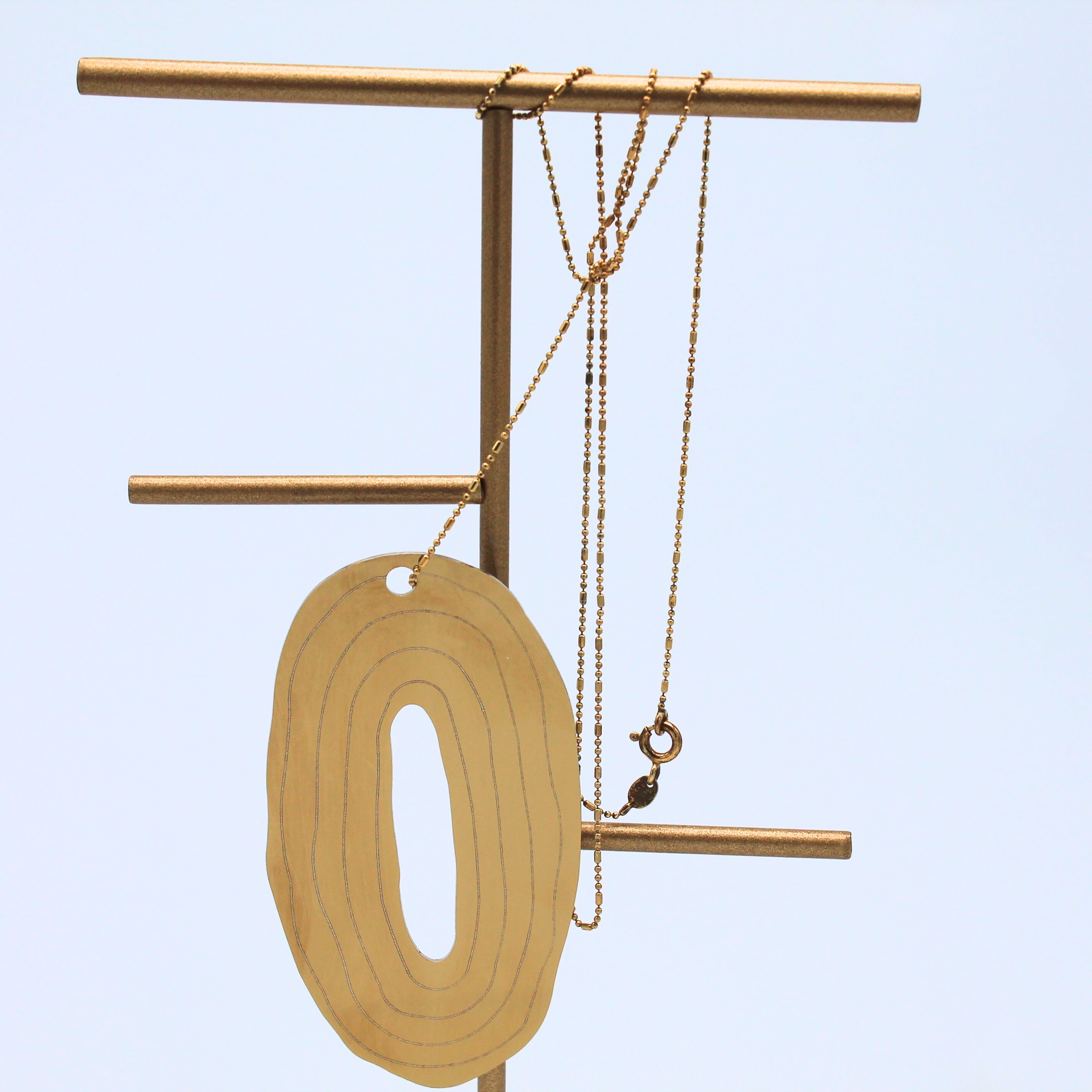 Ciondolo elisir gold